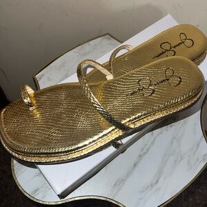Jessica Simpson Metallic gold snake print slide on sandals